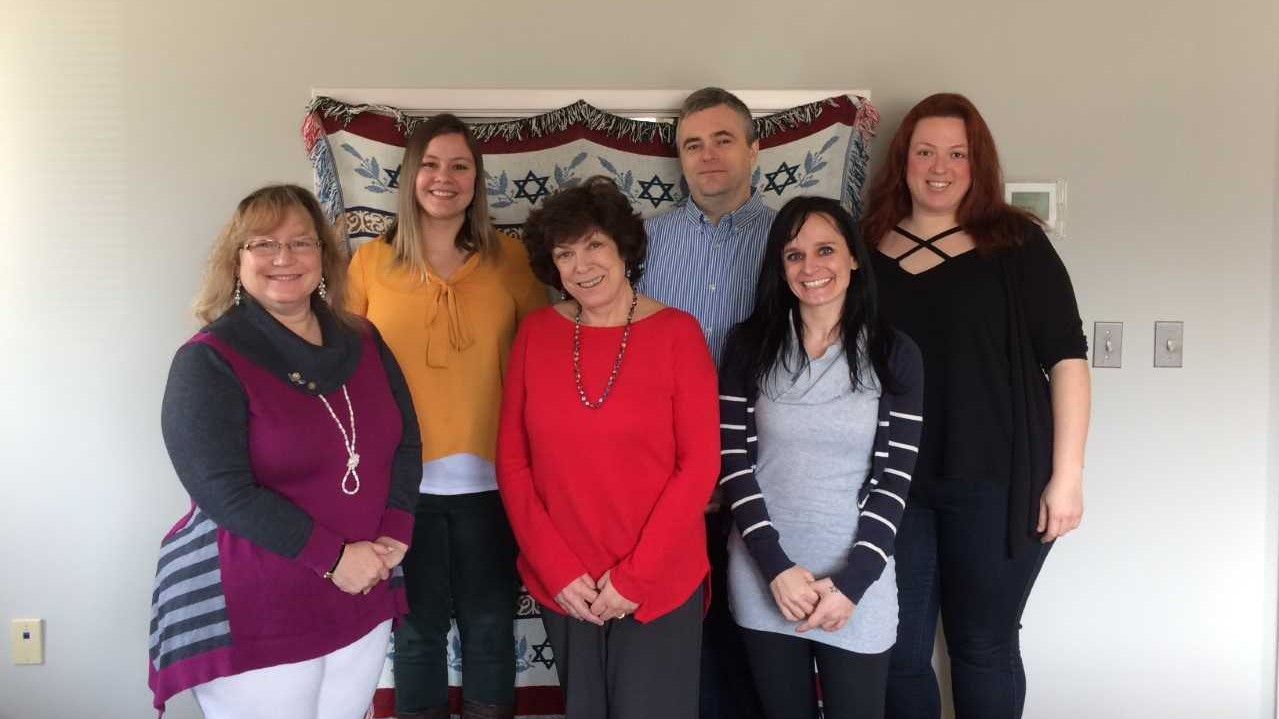 Team members of the JFCS Holocaust Survivor Support Program from left to right: Carol Lerner, Carly Bruski [back row), Jessica Rubinstein, Steve Zakusilo (back row), Janey Snyder, and Julia Eidelman. Photo courtesy of Carly Bruski.