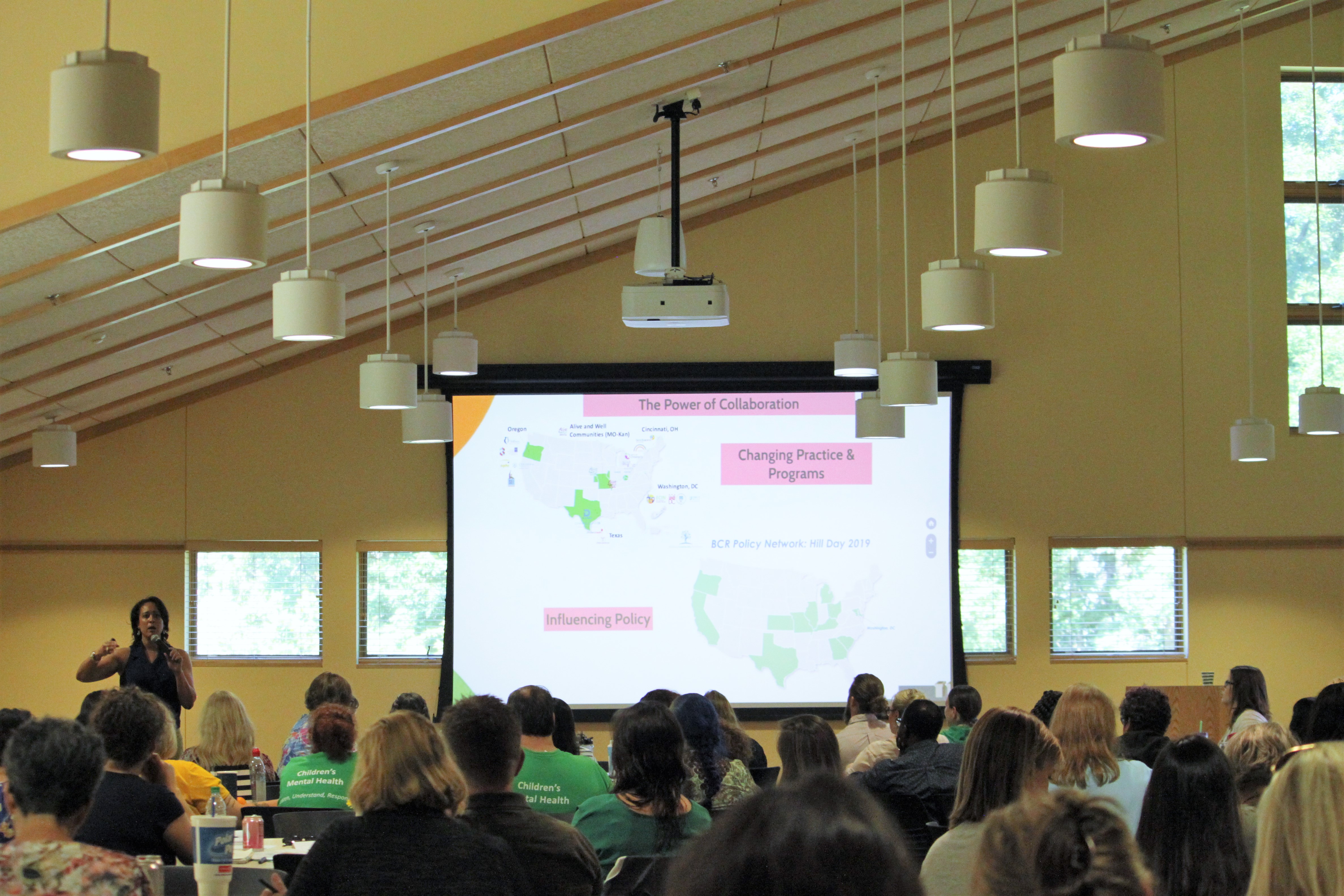 Dr. Wendy Ellis from George Washington University Building Resilient Communities was the keynote speaker at last year's Growing Resilient Communities: Collaboratives Addressing ACEs Gathering [June 2019). Photo by Ngoc Le. A room full of people listening to a speaker.